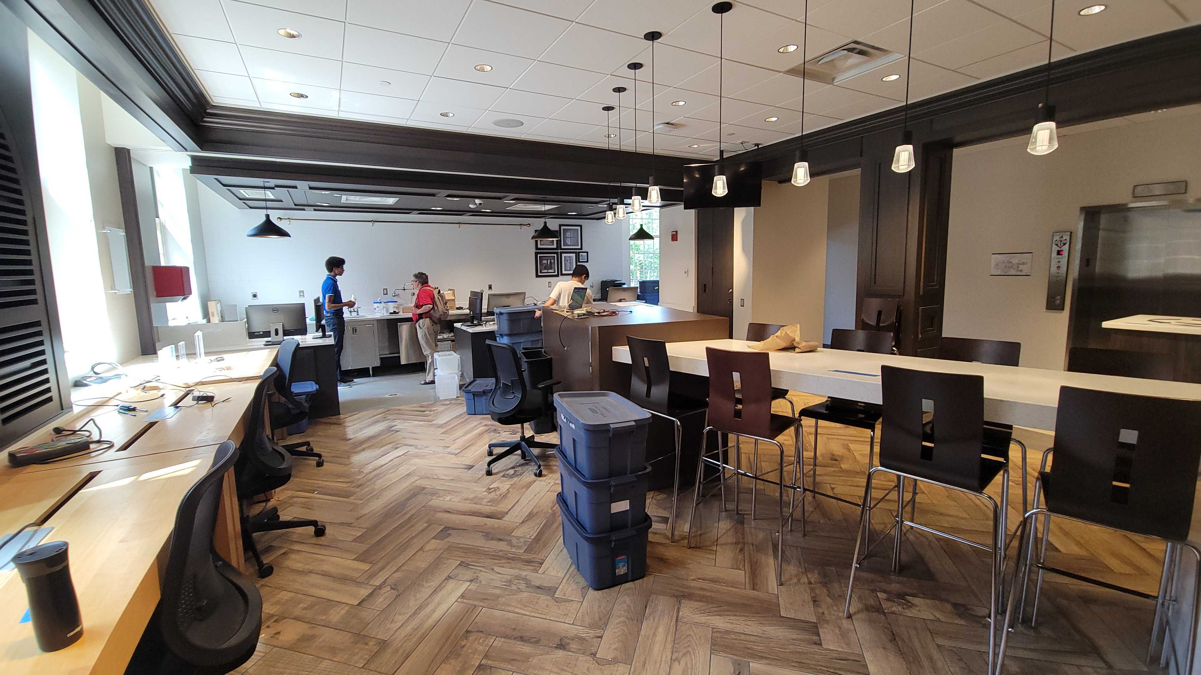 Folks working in the newly relocated Technology Support Lounge
