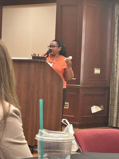 Belinda Worley holding an accessible xbox controller