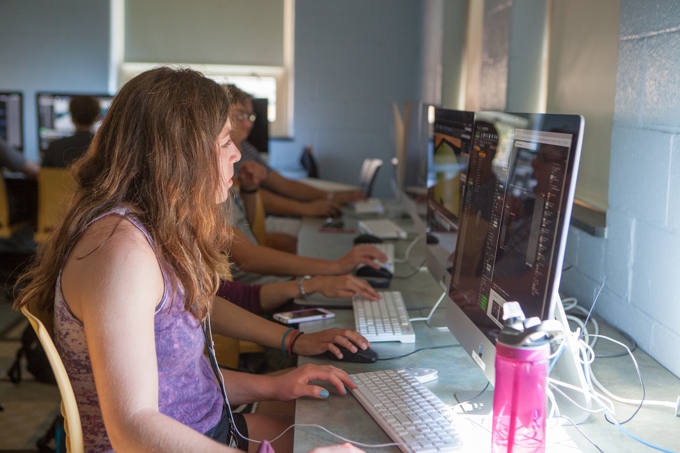 A student works at a computer in a Miami computer lab.