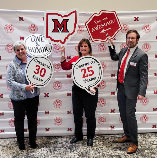 Leah Harris, Amy Moore, and David Seidl at the celebration of years of service