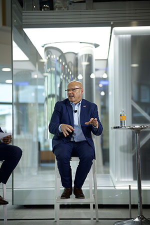 Dr. Crawford at the Cleveland Clinic partnership announcement, in front of the quantum computer