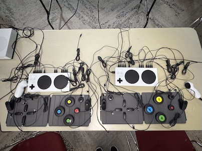 An overhead shot of accessible gaming controllers