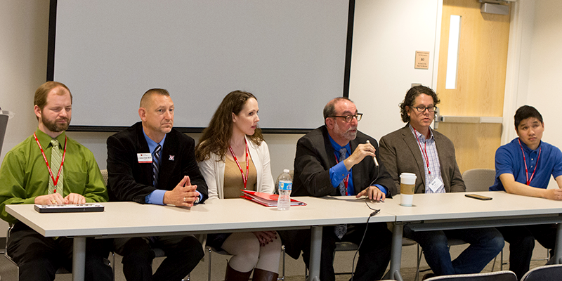 Panelists face the audience 