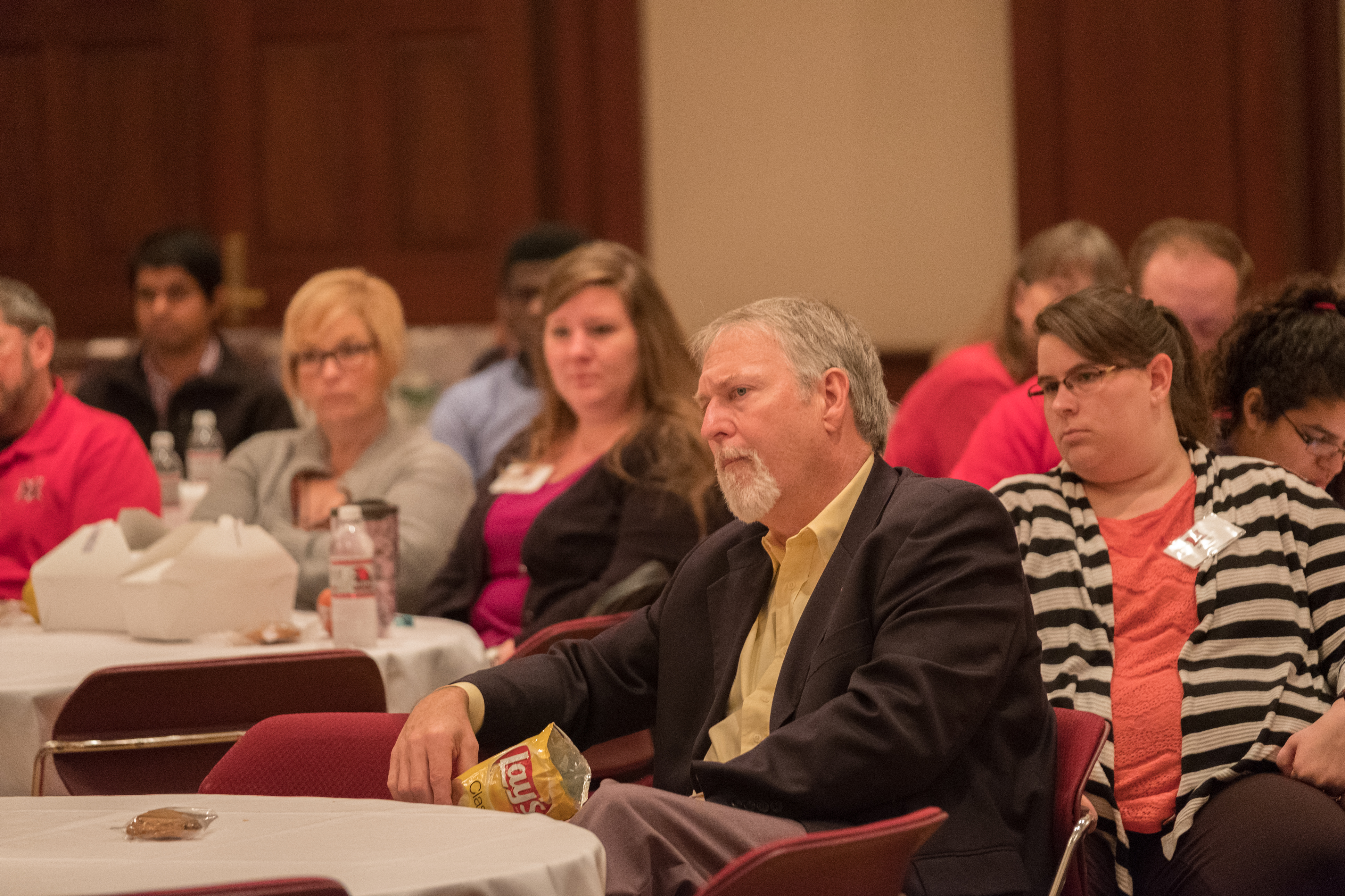Panelists speak to attendees during the AT Symposium.