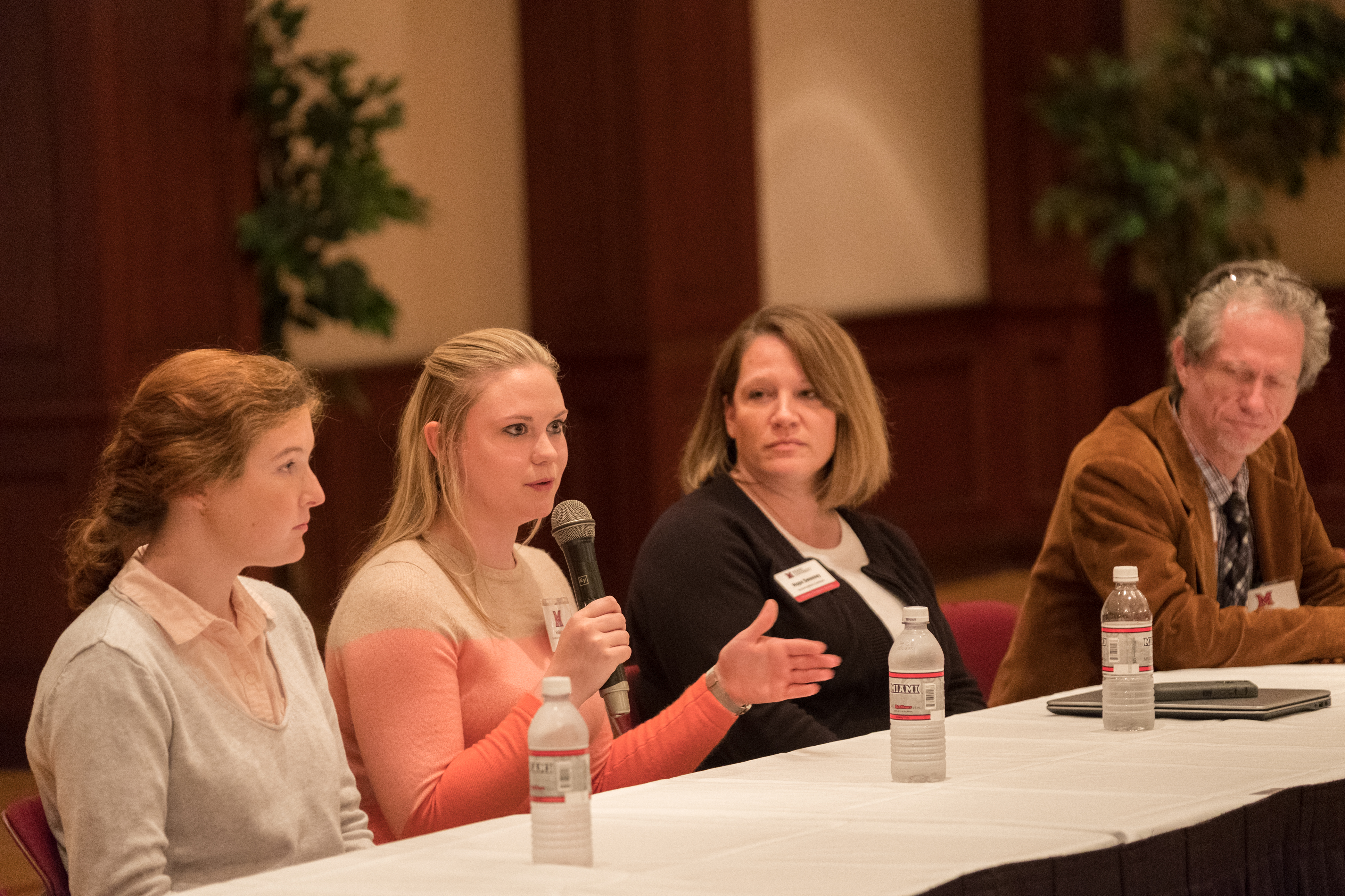 Panelists speak to the crowd during the AT Symposium.