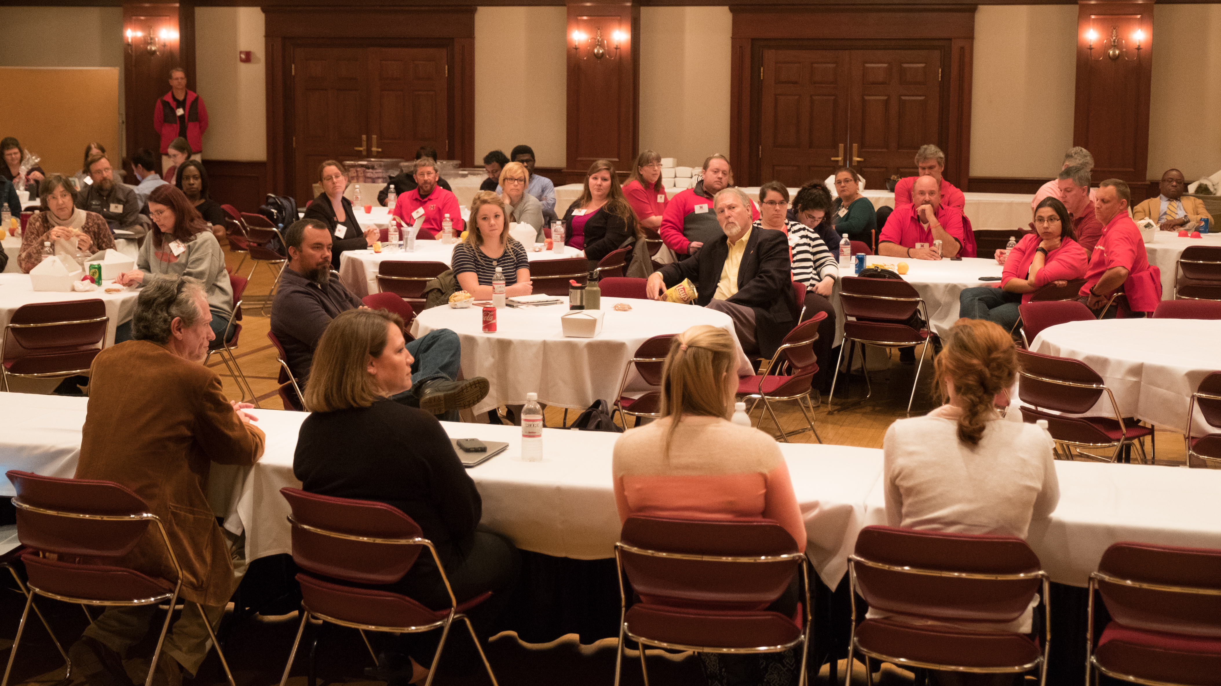 Panelists speak to the attendees during the AT Symposium.