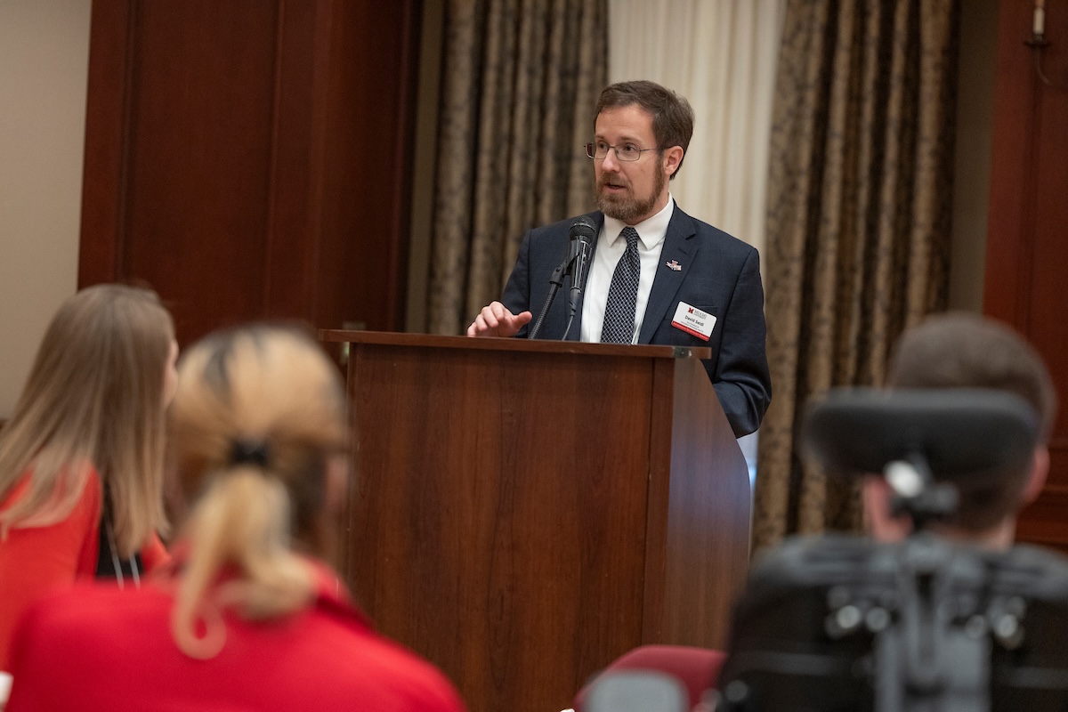 David Seidl speaks to the audience from the podium