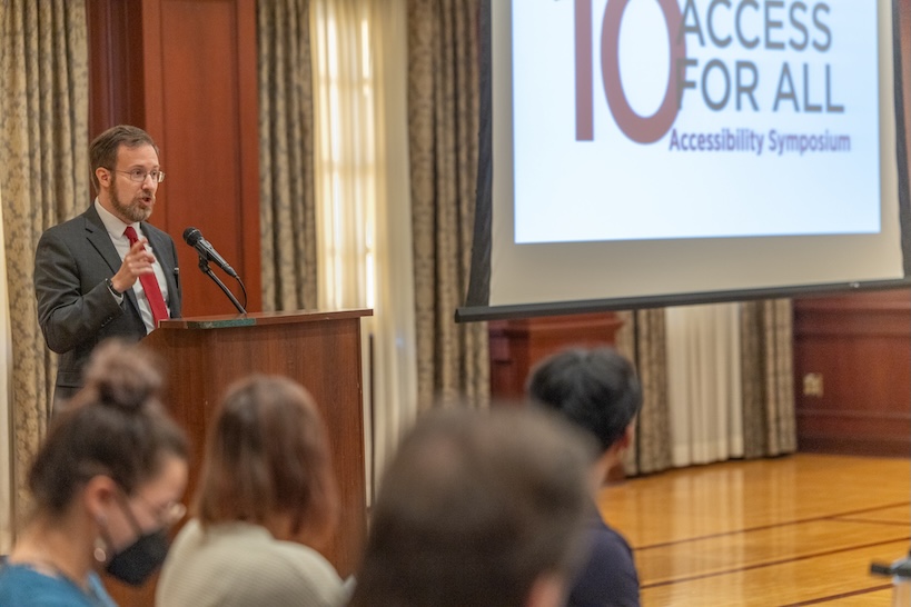 David Seidl speaks to the audience from the podium