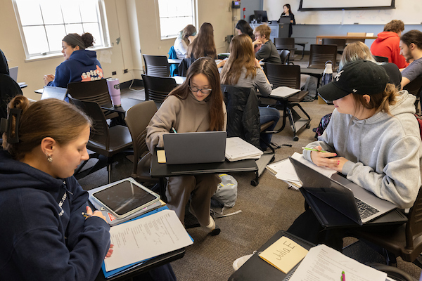 Students on computers in a classroom setting