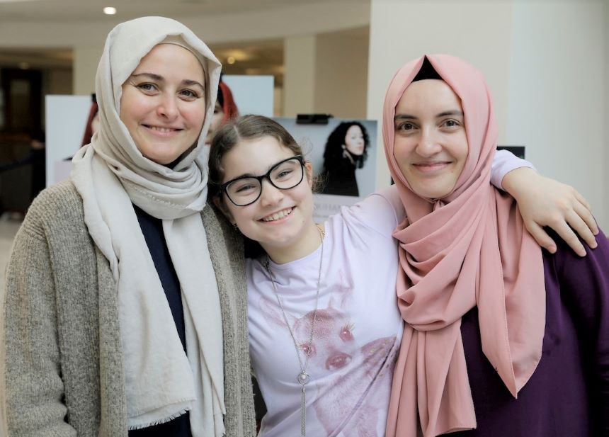 Three women celebrate World Hijab Day.
