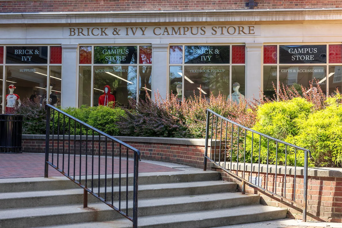 The red brick and glass exterior of the Brick and Ivy Campus Store