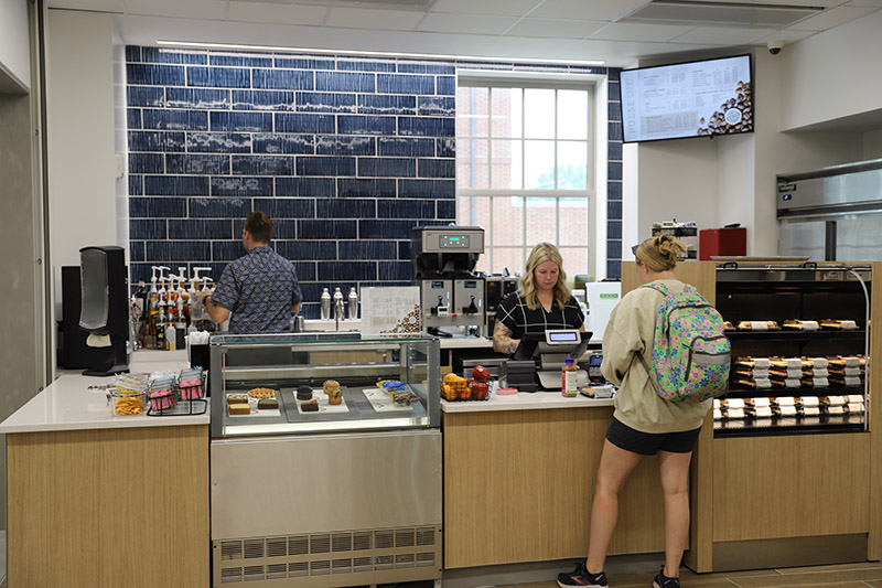 student at the checkout counter at pulse cafe