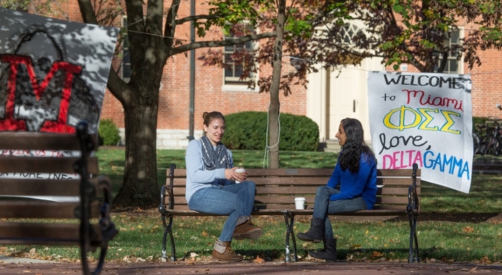 Students meeting for coffee at the seal in academic quad