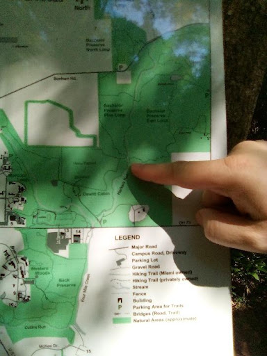 pointing to trail map in natural areas
