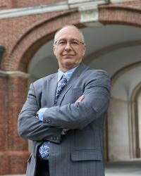 Chris Makaroff, Interim Provost, standing in front of Upham Hall