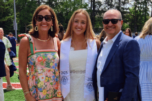 Olin Family. Mother, father, and daughter at high school graduation.