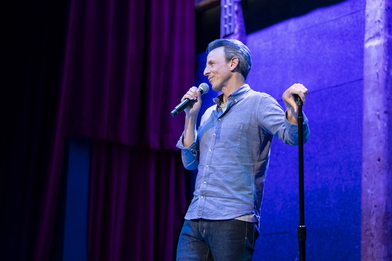 Seth Myers, on stage with a microphone.