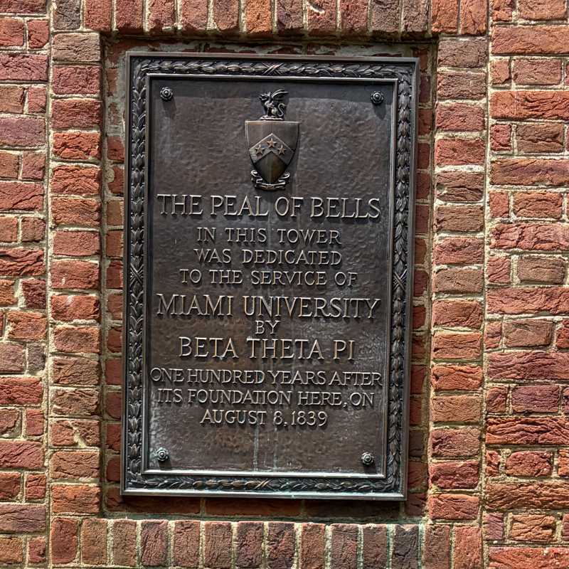 Plaque that reads The Peal of Bells in this tower was dedicated to the service of Miami University by Beta Theta Pi 100 years after its foundation here, on August 8, 1839.