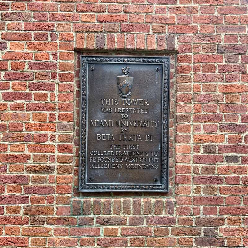 Plaque that reads This tower was presented to Miami University by Beta Theta Pi, The first college fraternity to be founded west of the Allegheny Mountains.