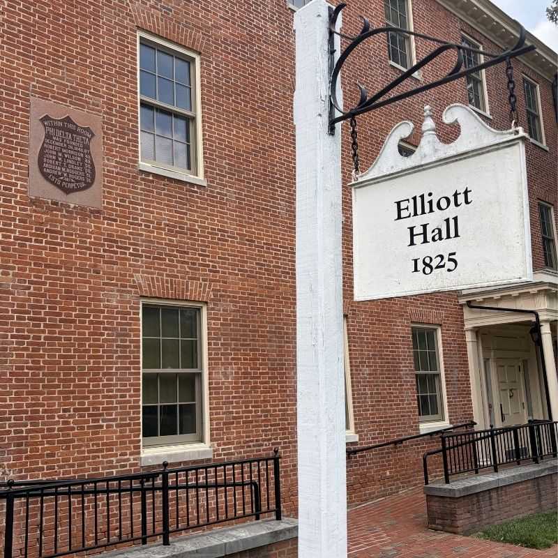 Exterior of Elliott Hall with an exterior plaque for Phi Delta Theta.
