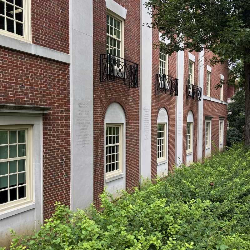 King Library's northern exterior wall, red brick with large concrete faux columns.