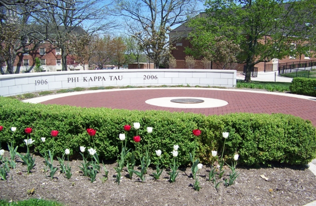Low semicircle wall that reads 1906 Phi Kappa Tau 2006.