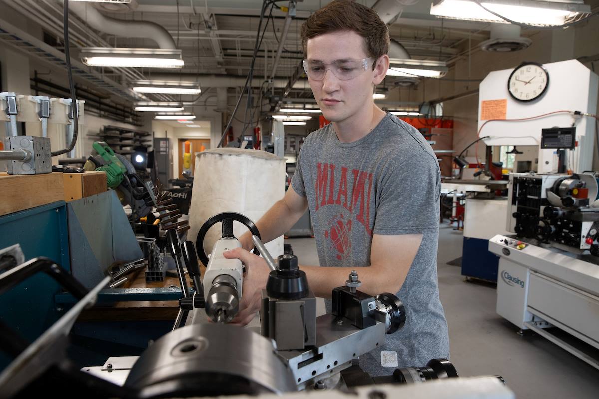 Eric Kronz working with machinery in the mechanical engineering lab at Miami University
