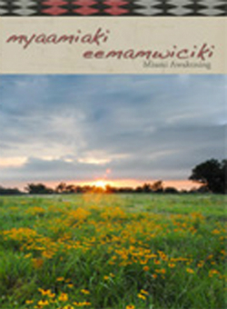 Publication cover including title and sunset over field of flowers