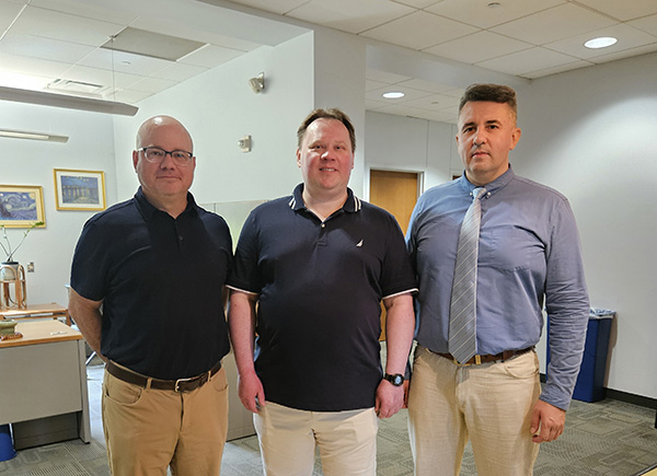 Norris, Garmatyuk, and Prydalnyi stand together in the College of Engineering and Computing. Garmatyuk earned his Electrical Engineering degree in Russia and his doctorate from the University of Nebraska-Lincoln (photo provided by Norris).