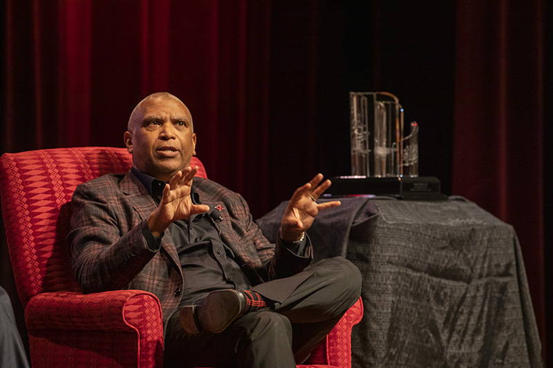 Reginald Hudlin in discussion during a special awards ceremony.