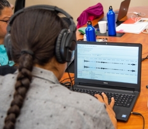 A National BoL participant listens to an audio clip of his Native language.