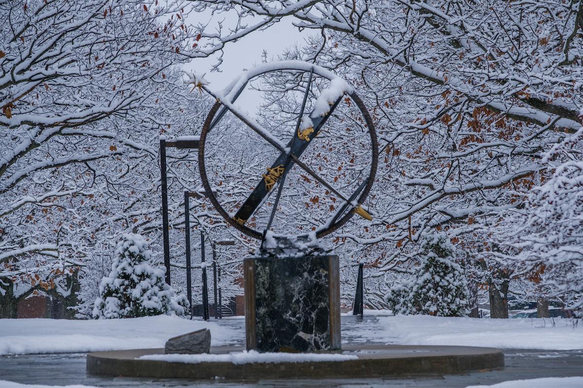 Sundial covered in snow in winter