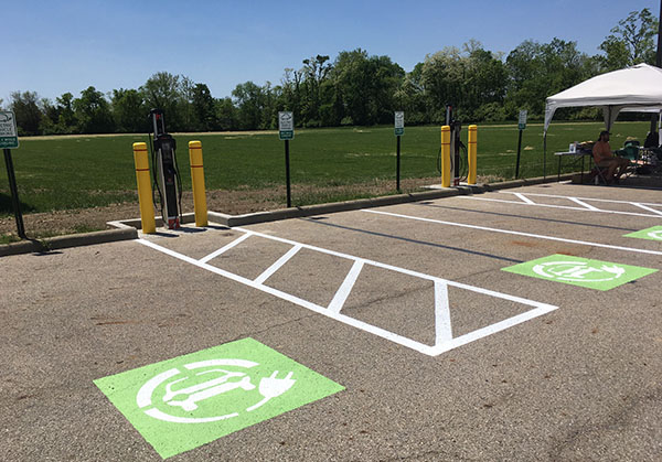 EV charging station at Chestnut Fields parking lot with blue sky in background