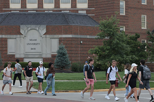 Students cross Patterson Avenue in front of Pearson hall