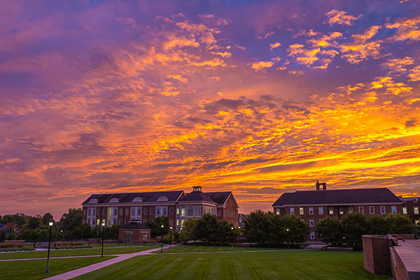 Sunrise over the psychology building and Pearson Hall