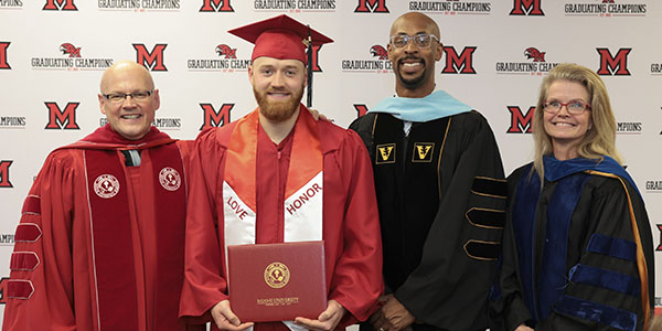 Miami University President Gregory Crawford; Sam Bachman; Dean of the College of Liberal Arts and Applied Science Ande Durojaiye; and University Ambassador Dr. Renate Crawford