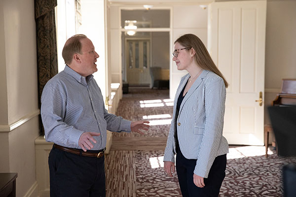 Zeb Baker, founding executive director of Miami University's Honors College, talks to Honors College student Cameron Tiefenthaler.