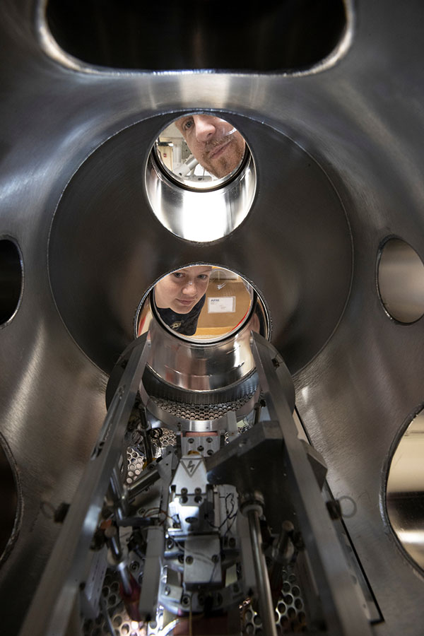 Perry Corbett and Sara McGinnis look through the recently donated ultra-high vacuum scanning tunneling microscope.