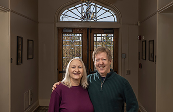 Chris and Lynn Myers framed by Peabody Hall front door