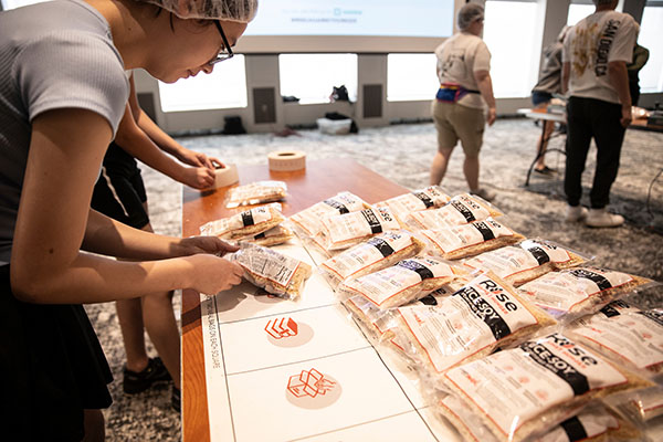 An estimated 175 Miami students and Student Life staff help assembled meal packages for Rise Against Hunger as part of Welcome Weekend 2024 on Aug. 24 at Armstrong Student Center.