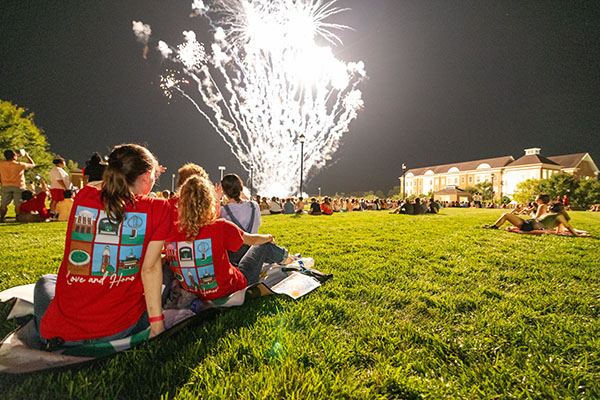 Students watch the fireworks display during the 2023 Welcome Weekend at Miami University.