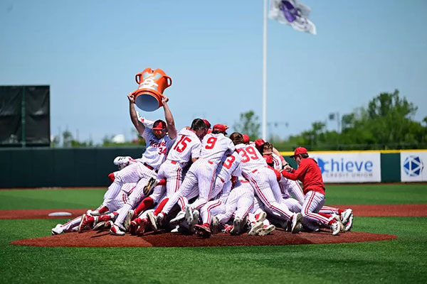 The Miami baseball team collasped in a celebratory pile while dumping a large container of Gatorade on team members
