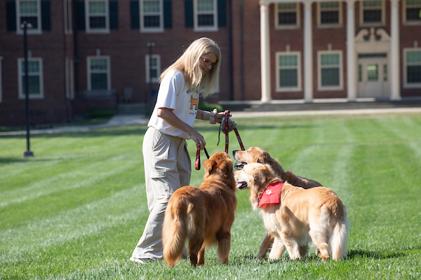 Renate Crawford interacts with Newton, Ivy, and Charlie.