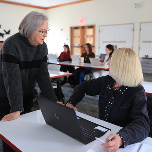 Debbie Brown talks to Sandra Garner, chair and associate professor of Global and Intercultural Studies, who teaches Brown’s 300-level course on Native American Women (photo by Jeff Sabo).