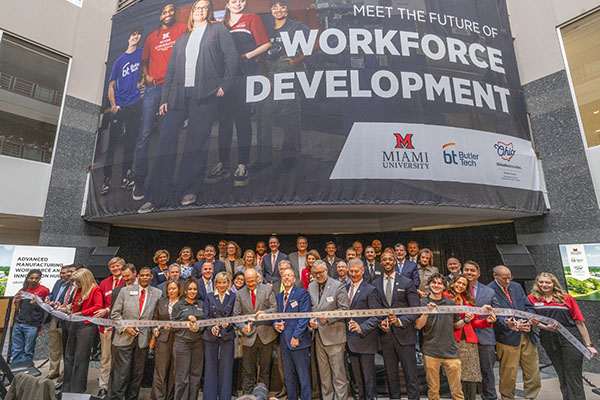 A large group of people at the ribbon cutting ceremony