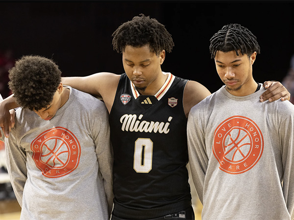 Three Miami University men's basketball players reflect before the Love.Honor.Care game. 