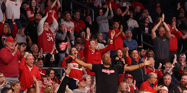 Ron Harper, center, leads the crowd at UD Arena