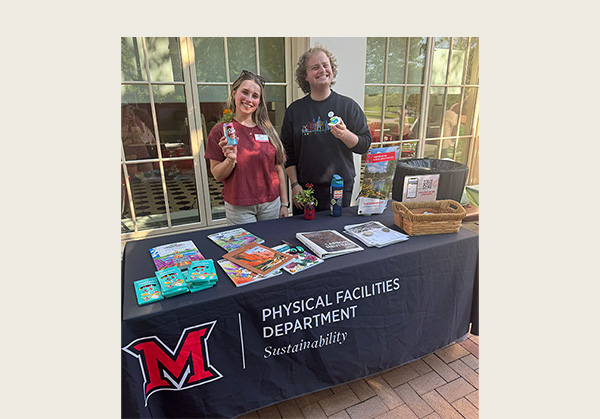 alex miller and john day at office of sustainability table