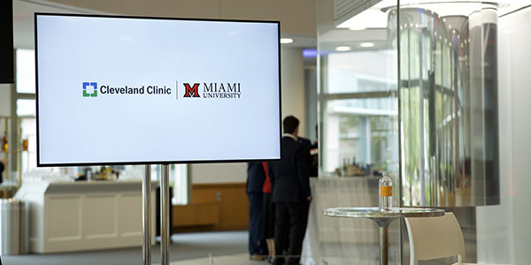 Cleveland Clinic and Miami University logos on a screen