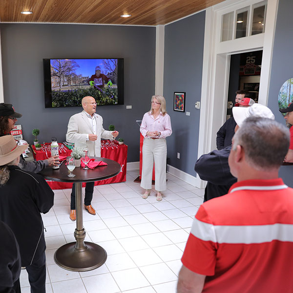 Miami University President Gregory Crawford, left, and University Ambassador Dr. Renate Crawford talk during a special ceremony at Lewis Place on May 21.
